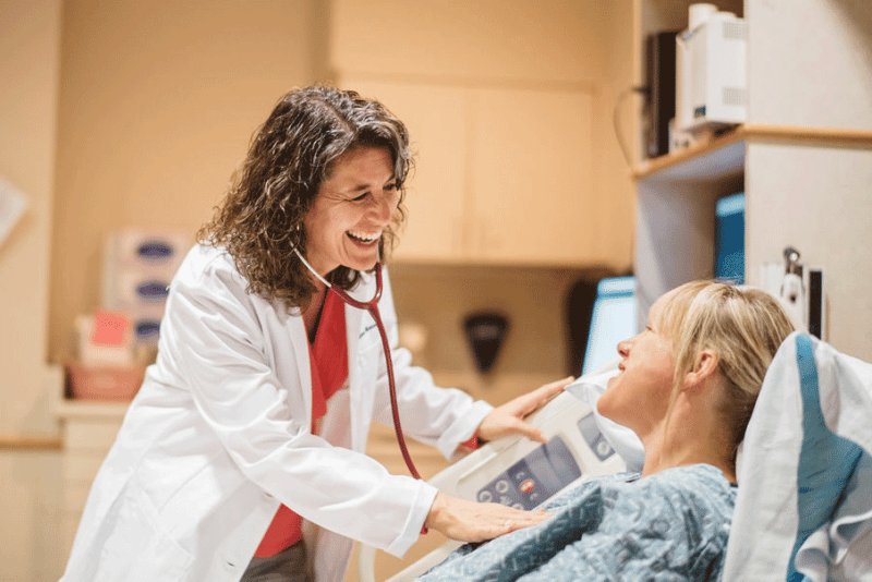 Women's health of central virginia doctor reassuring patient about prenatal care