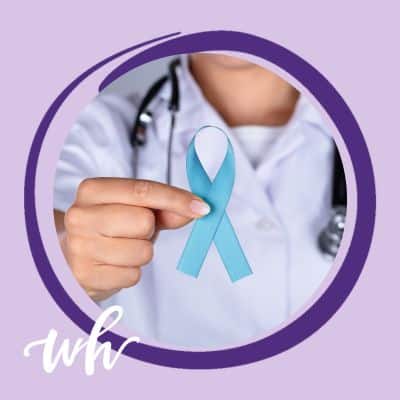 Doctor holding a blue ovarian cancer ribbon