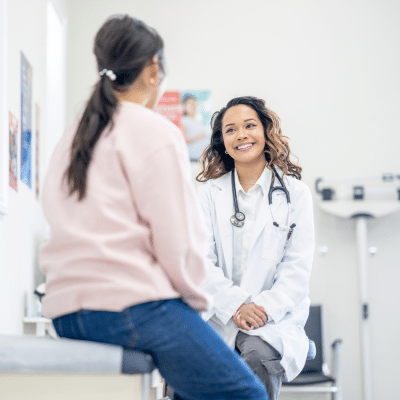 Female patient talking to a female doctor, representing sexual health