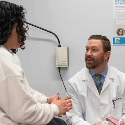 Why weight loss matters — health benefits beyond looks 3 Women’s health of central virginia doctor meeting with a patient, representing the health benefits of weight loss for women